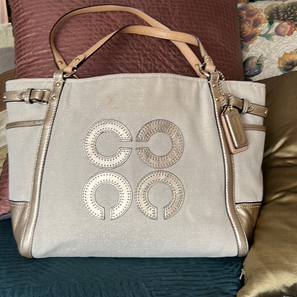 COACH :  tote shoulder bad.  Creamy beige color with GOLD color accents.